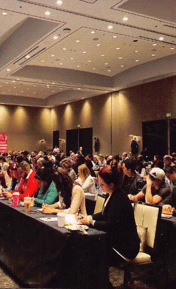 Packed ballroom of entrepreneurs at a Powerteam event